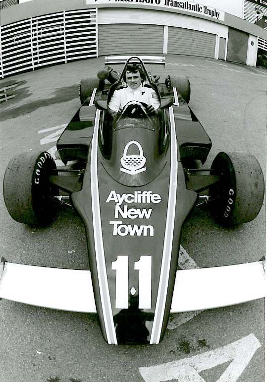 Photograph of a race car sponsored by Aycliffe New Town