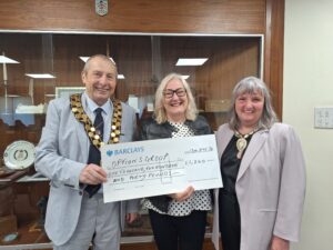 Presentation of a cheque to Linda West of Options Group by the outgoing Mayor Councillor Ken Robson